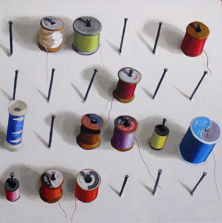 Cotton reels, spools of thread on a board